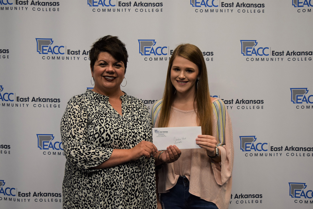 Swindle Scholarship recipient, Caroline Ward, receives Foundation scholarship award from Niki Jones, EACC Director of Development